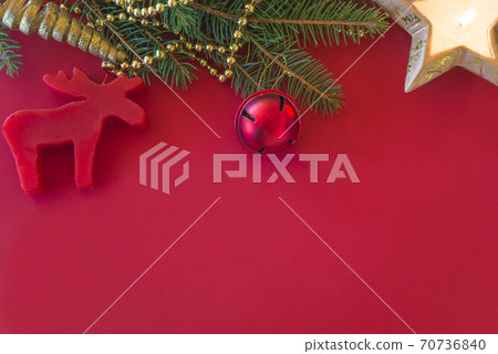 Template for christmas holiday greeting card. fir branch and christmas decoration on red background. Space for text, flat lay 70736840