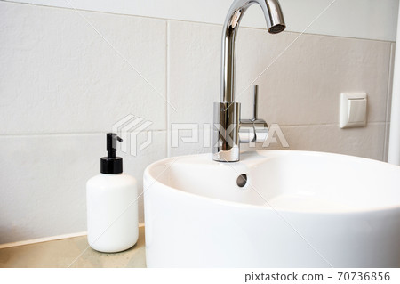 White blank bottle of soap dispenser near modern sink in bathroom, hand wash clean luxury interior hand wash 70736856