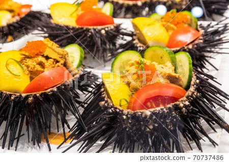 Close-up of dressed raw sea urchins from the market 70737486