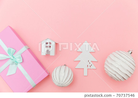 Simply minimal composition winter objects ornament sled fir tree ball gift box isolated on pink pastel trendy background Simply minimal composition winter objects ornament sled fir tree ball gift box isolated on pink pastel trendy background 70737546