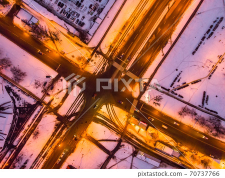 Aerial winter sunset drone view. Crossroads of walkways in residential district Aerial winter sunset drone view. Crossroads of walkways in residential district 70737766
