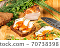 smoked meat lies on the table with herbs and sauce 70738398