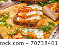 smoked meat lies on the table with herbs and sauce 70738401