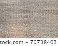 Weathered stained old brick wall background on surface 70738403