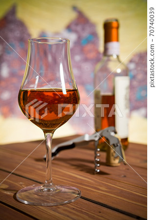 Closeup of a glass of Italian vin santo wine Closeup of a glass of Italian vin santo wine 70740039