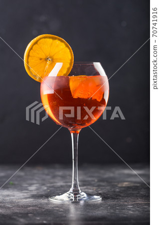 Refreshing alcohol cocktail in glass placed on table. High quality photo 70741916