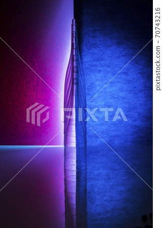 Still life with glass objects on a colored background 70743216