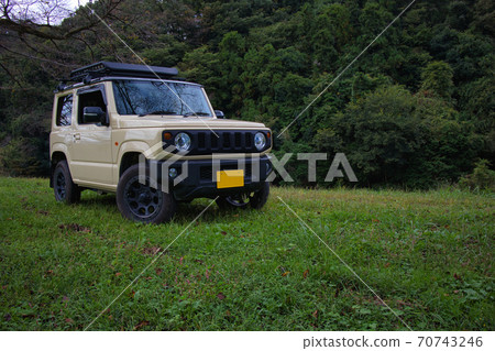 Drive off-road with a four-wheel drive mini vehicle. 70743246