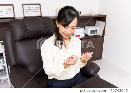 Senior women enjoying nails and beauty 70743645