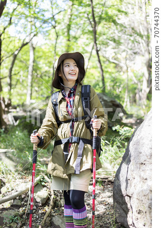 Woman trekking Woman trekking 70744370