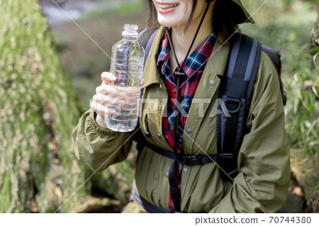 Woman trekking 70744380