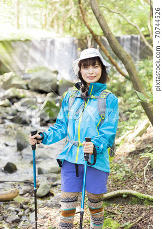Woman trekking 70744526