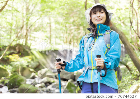 Woman trekking 70744527