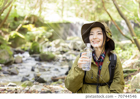 Woman trekking 70744546
