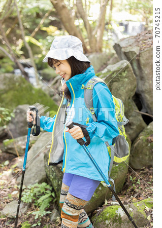 Woman trekking Woman trekking 70745215