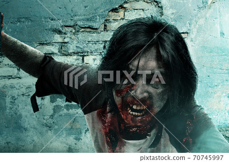 Scary zombie with blood and wound on his body crawling Scary zombie with blood and wound on his body crawling 70745997
