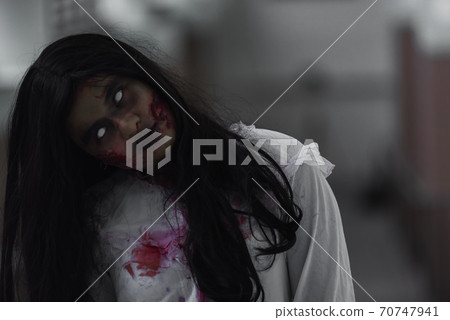 Female zombie in blood devil is scary she haunted at the abandoned building Female zombie in blood devil is scary she haunted at the abandoned building 70747941