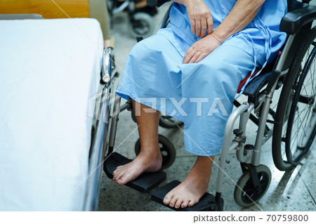 Asian senior or elderly woman patient sitting on wheelchair in hospital. Asian senior or elderly woman patient sitting on wheelchair in hospital. 70759800