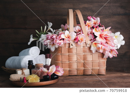Spa products with organic soap luffa scrub compress ball,pink salt,black stones and beautiful flower on wooden tray isolated on white background with clipping path. Spa products with organic soap luffa scrub compress ball,pink salt,black stones and beautiful flower on wooden tray isolated on white background with clipping path. 70759918
