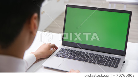 man look green screen laptop 70760002