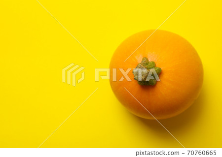 Round zucchini on yellow background, top view Round zucchini on yellow background, top view 70760665