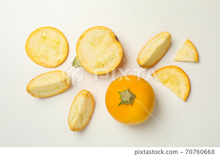 Round zucchini and slices on white background, top view 70760668