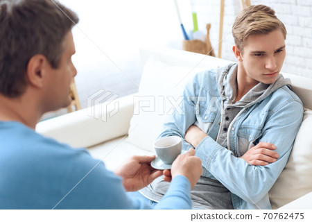 Dad with son at home with family problems. Dad with son at home with family problems. 70762475