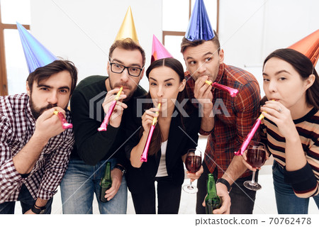 People in tubes and holiday cones on their heads People in tubes and holiday cones on their heads 70762478