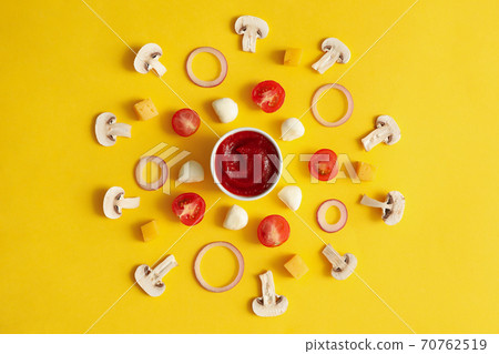 Ingredients for cooking pizza on yellow background Ingredients for cooking pizza on yellow background 70762519