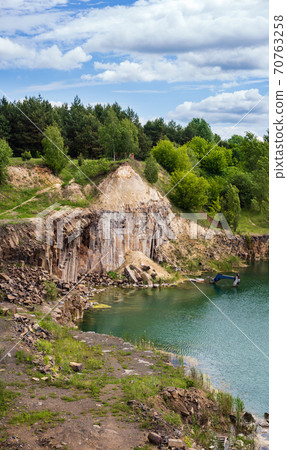 Drowned in flooded basalt querrie excavator 70763258