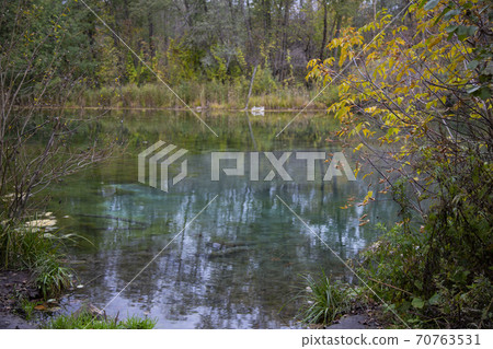 The shore of the lake in the autumn forest. Autumn The shore of the lake in the autumn forest. Autumn 70763531