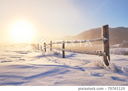 Mysterious winter landscape majestic mountains in winter. Magical winter snow covered tree. Photo greeting card. Carpathian. Ukraine 70765120