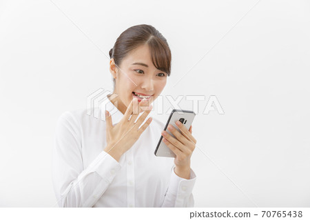 A smartphone and a woman 70765438