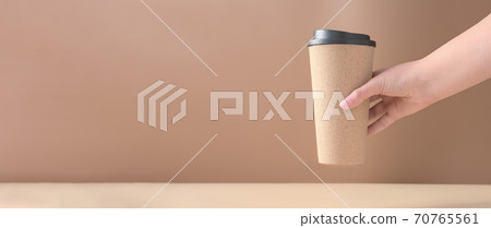 trendy coffee mug in female hand. 70765561
