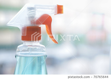 sprayer with detergent cleaning product. Home cleaning and Housekeeping concept.  70765644
