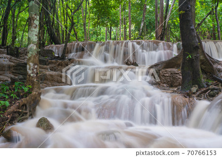 Waterfall scene at Pha Tad Waterfalls in rainforest  at the Khuean Srinagarindra National Park 70766153
