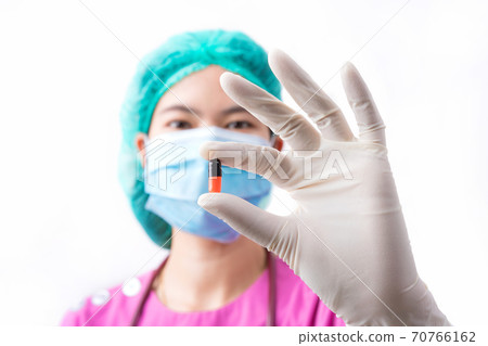 Doctor woman holding pill or medication in capsule. concept of pharmacist, drugs, diet pill, Doctor woman holding pill or medication in capsule. concept of pharmacist, drugs, diet pill, 70766162