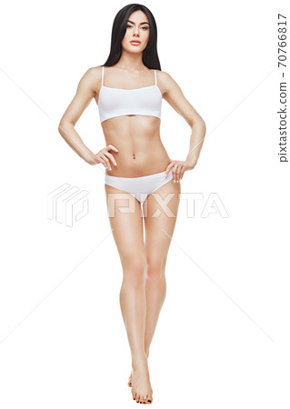 Fitness young woman with a beautiful body on white background 70766817
