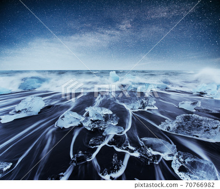 Icebergs floating in Jokulsarlon glacial lake. South Iceland. Lagoon. Starry sky night. Fantastic milky way. Icebergs floating in Jokulsarlon glacial lake. South Iceland. Lagoon. Starry sky night. Fantastic milky way. 70766982