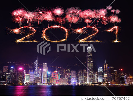 2021 Happy New Year fireworks over Hong Kong cityscape at night 70767462