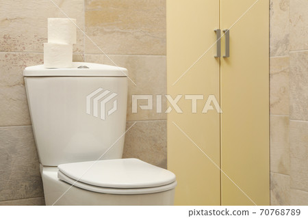 Toilet bowl in modern bathroom in light beige color Toilet bowl in modern bathroom in light beige color 70768789
