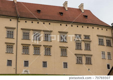Fragment of a Wawel castle a wall and roof with roof tile. Wawel castle in Krakow Fragment of a Wawel castle a wall and roof with roof tile. Wawel castle in Krakow 70769307