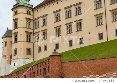 Fragment of a Wawel castle a wall and a tower. Wawel castle in Krakow Fragment of a Wawel castle a wall and a tower. Wawel castle in Krakow 70769311