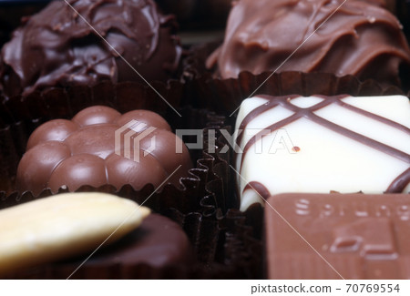 Box with chocolate candies 70769554