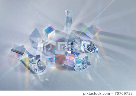 Crystal refracting light in rainbow colors on cold background. 70769732