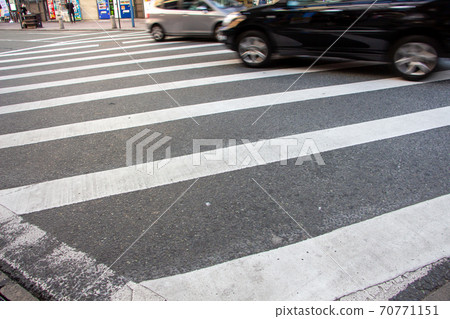 Vehicles crossing a scrambled intersection Vehicles crossing a scrambled intersection 70771151