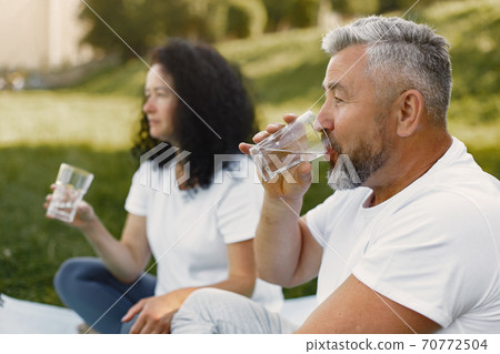 Happy elderly senior couple doing yoga 70772504