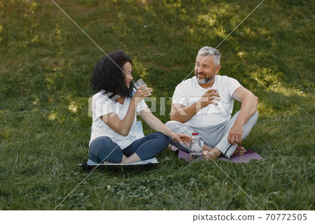Happy elderly senior couple doing yoga 70772505
