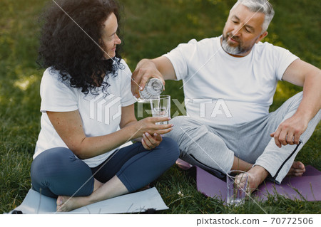 Happy elderly senior couple doing yoga 70772506