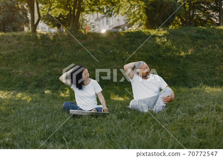 Happy elderly senior couple doing yoga 70772547
